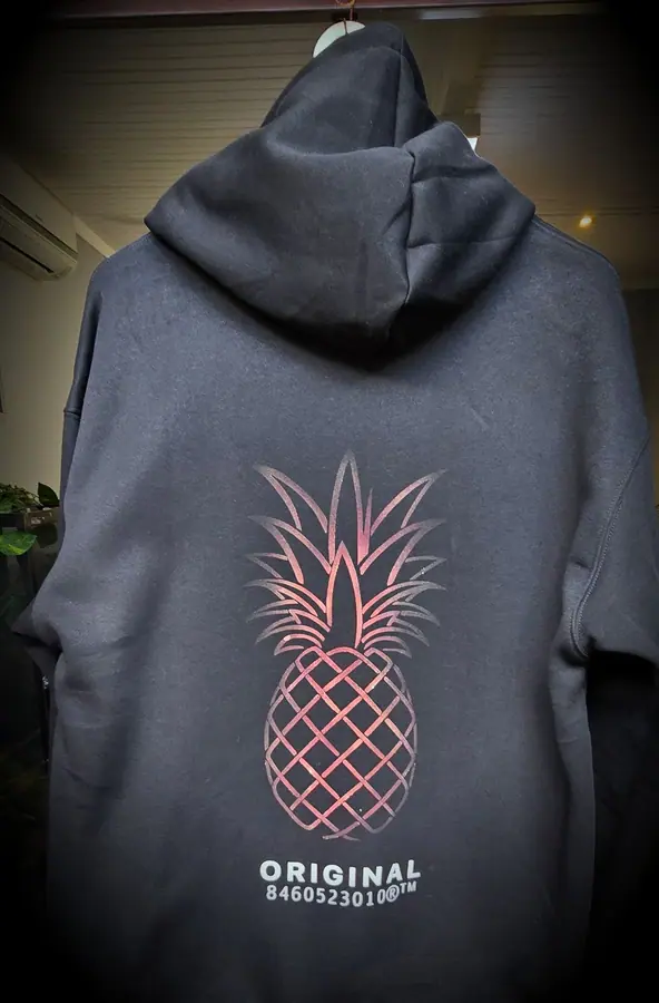 Custom printed hoodie produced in the Resin 8 Studios apparel workshop