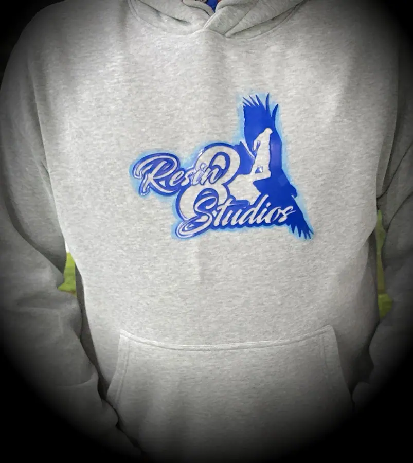Printed chest artwork on a custom hoodie by Resin 8 Studios