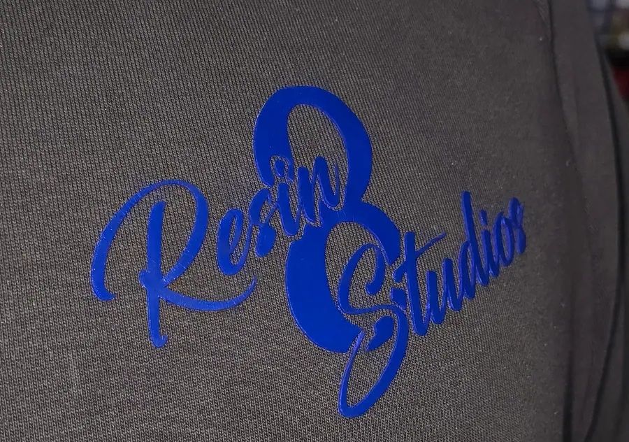 Close-up of print and embroidery detail on a garment by Resin 8 Studios