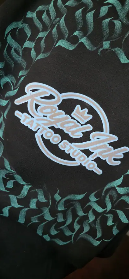 Close-up of print and embroidery detail on a garment by Resin 8 Studios