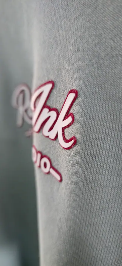 Close-up of print and embroidery detail on a garment by Resin 8 Studios