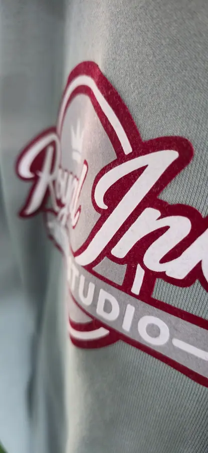 Close-up of print and embroidery detail on a garment by Resin 8 Studios