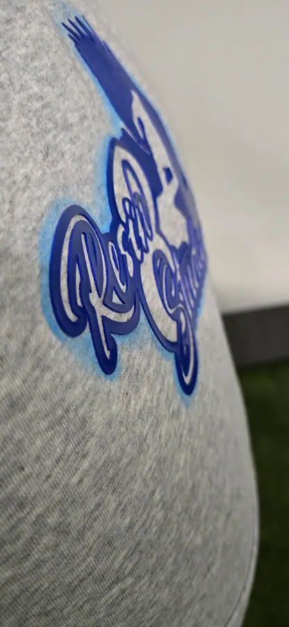 Close-up of print and embroidery detail on a garment by Resin 8 Studios