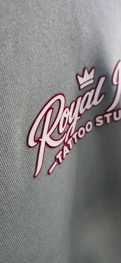 Close-up of print and embroidery detail on a garment by Resin 8 Studios
