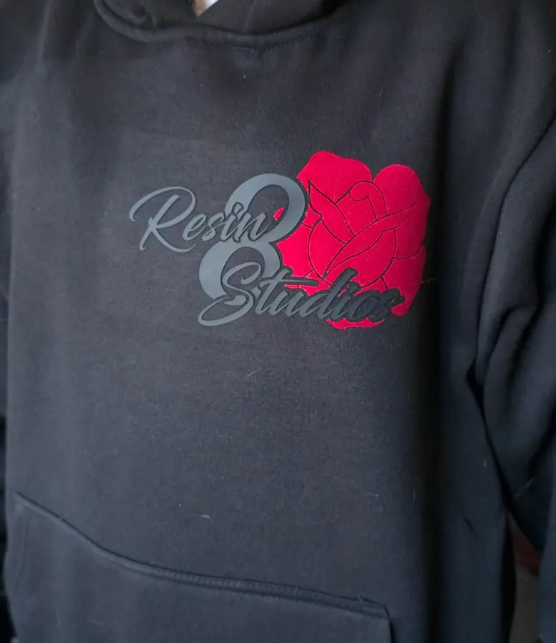 Embroidered chest artwork on a custom hoodie by Resin 8 Studios